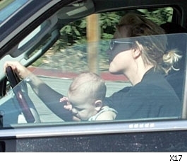 Britney Spears driving with Sean Preston in her lap.