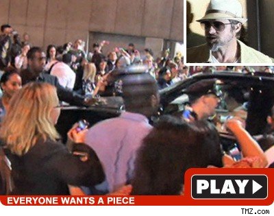Brad & Maddox Take Center Stage Brad Pitt: Click to watch