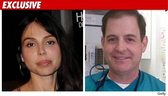 Oksana Grivorieva and Dentist Dr. Ross Sheldon 0716_oksana_dentist_EX_Getty_01