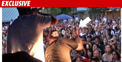 Paul Wall Beats Fan with a Microphone