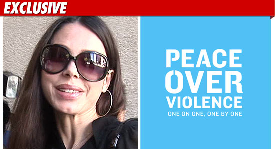 1115_oksana_peace_over_violence_EX_tmz