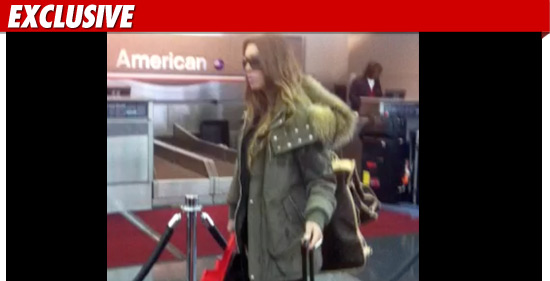 120110_rachel_uchitel_ex_airport_tmz