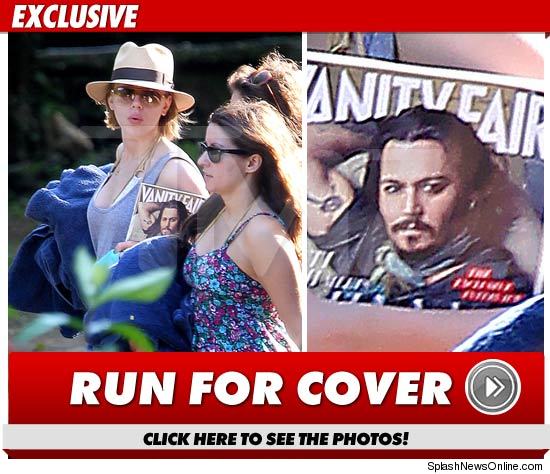 scarlett johansson in jamaica with vanity fair cover of johnny depp