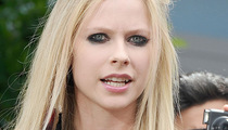 Avril Lavinge's Concert Scare -- Fan Rushes Her On Stage!