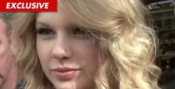 Taylor Swift Threatens Lawsuit Over Topless Photo