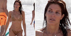 Stephanie Seymour -- Spills Out Onto the Beach