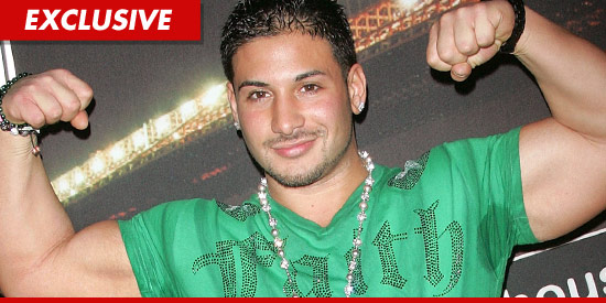 Emilio Masella flexing his muscles.