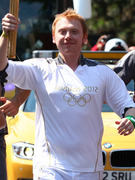 "Harry Potter" Star Rupert Grint Carries the Olympic Torch!