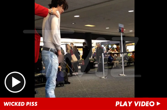 0102-wicked-piss-tmz