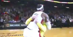 LeBron James -- Bear Hugs Fan After Halfcourt Shot