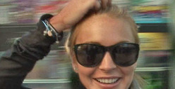 Lindsay Lohan Settles Beef With Paparazzo ... Over Squashed Foot