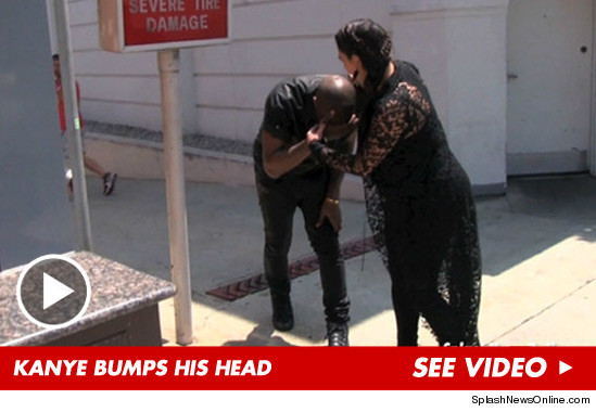 0611_kanye_bumps_head_article