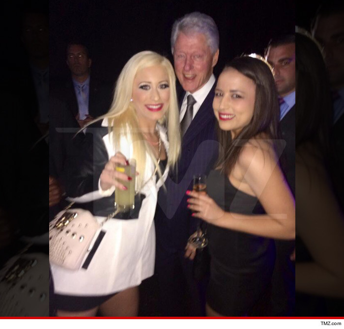 Bill Clinton poses with two prostitutes named Barbie Girl and Ava Adora