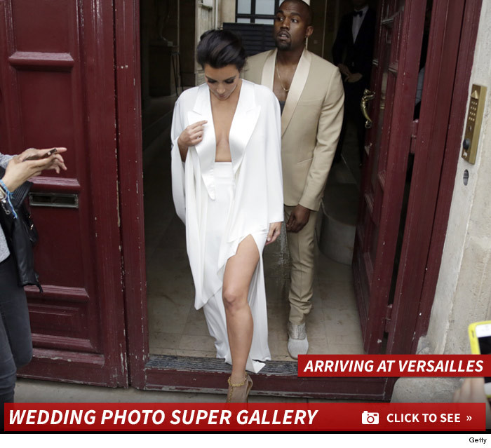 0523_kim_kardashian_kanye_west_versailles_arriving_launch