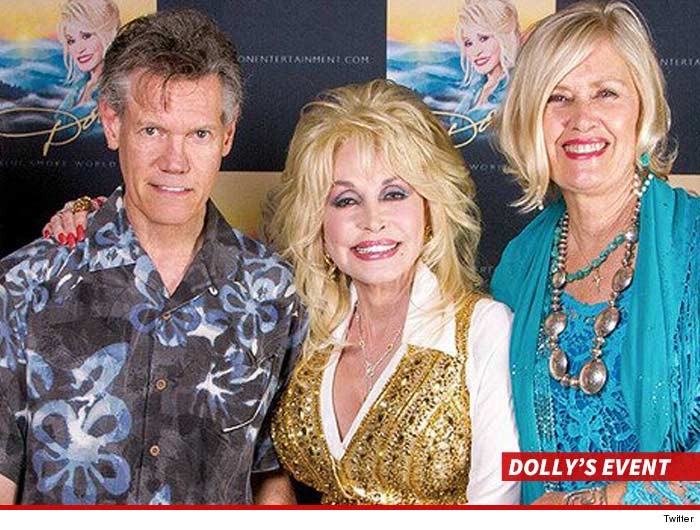0619-randy-travis-dolly-parton-twitter-WITH-SWIPE-2