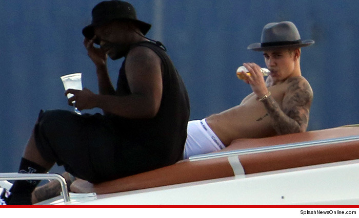 0703-bieber-drinking-on-boat-SPLASH-01
