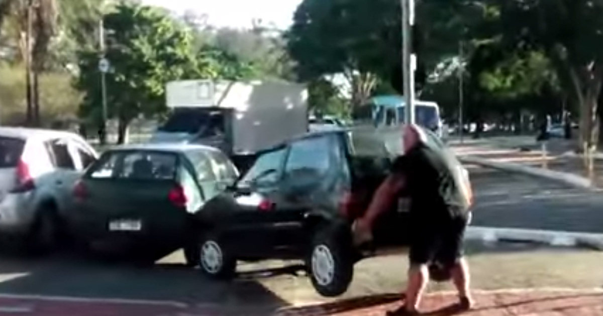 Hulking Cyclist -- Moves Car Out Of Bike Path ... By Picking It Up!!!