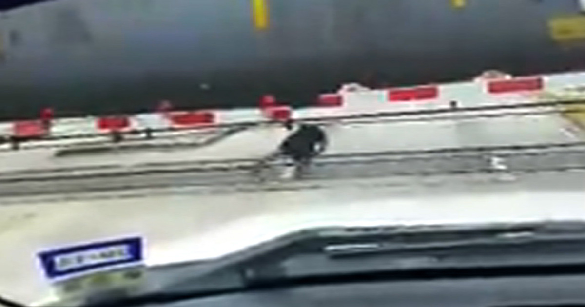 Man Defies Death -- Rolls Under Moving Train!!