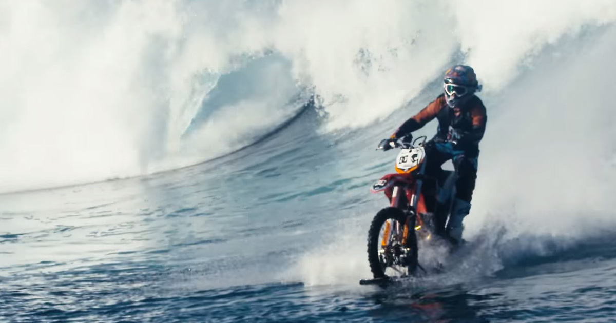 Awesome Surfing Motorbike -- Speeds Across Tahitian Waves