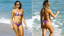 Anastasia Ashley Shows Off Purple Bikini, Gets Wet at Miami Beach
